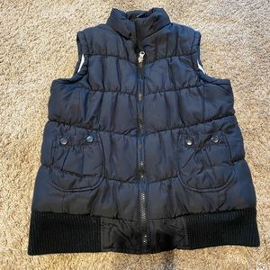 black zip up vest with tie back
